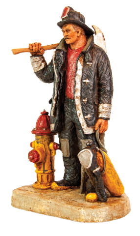 Michael Garman Fire fighter sculptor with axe on shoulder, standing next to a fire hydrant.