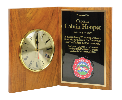 Solid walnut book plaque 9 ½” high with 5” quartz clock and brass engraving plate.