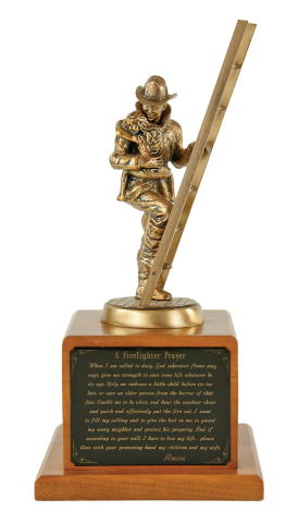 Bronze firefighter on a ladder rescuing a child; mounted on a solid walnut base. Firefighter’s Prayer may be engraved on brass plate.