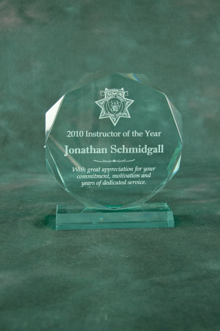 Acrylic beveled octagon mounted on acrylic base, reverse engraved with your message and department logo. Available in glacier blue, jade green, or clear acrylic.