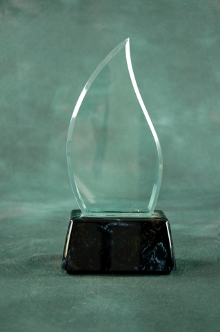 Flame shaped acrylic mounted on a black marble finished base.